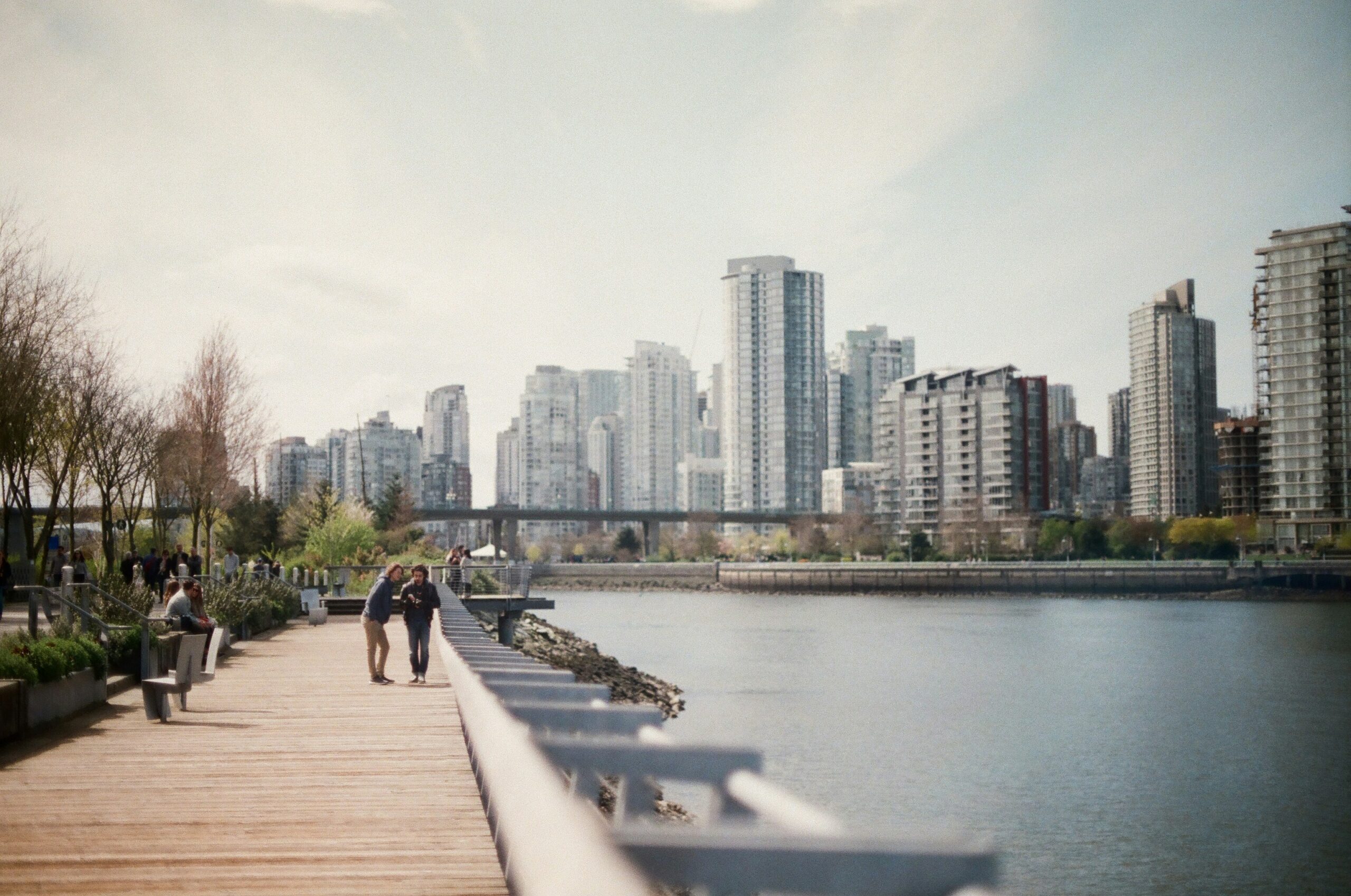 People walking along the False Creek seawall in Vancouver’s Yaletown neighbourhood